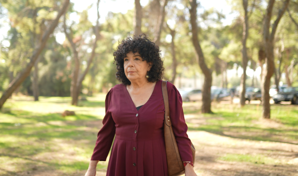 Maria K, SOLACE, lung screening participant from Athens, Greece. Maria is walking through green space near the hospital.