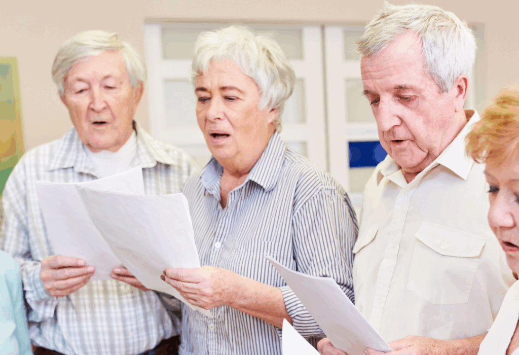 A group of older people signing together